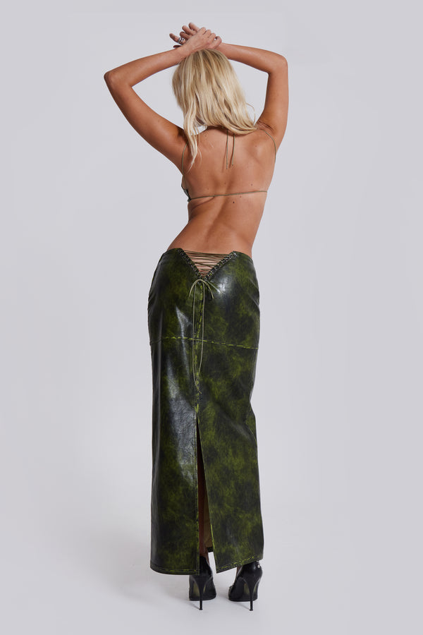 Female model wearing green faux leather maxi skirt .