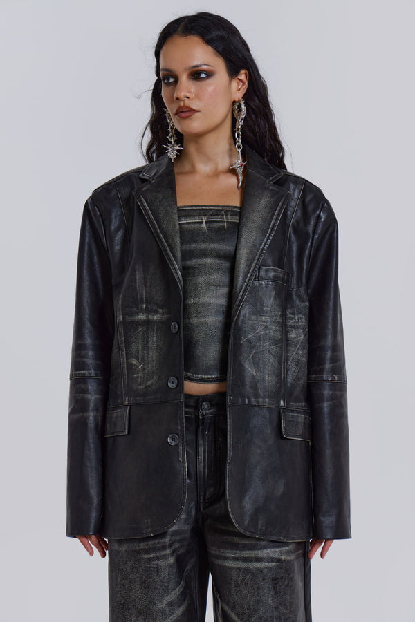 Introducing the Ash Blazer - crafted from a faux leather PU fabric with a unique heavy acid wash finish in an off-black colourway, this oversized fit blazer features a two-button front, jet pockets with flaps on the chest and a back vent, the blazer is fully lined and perfect for layering.