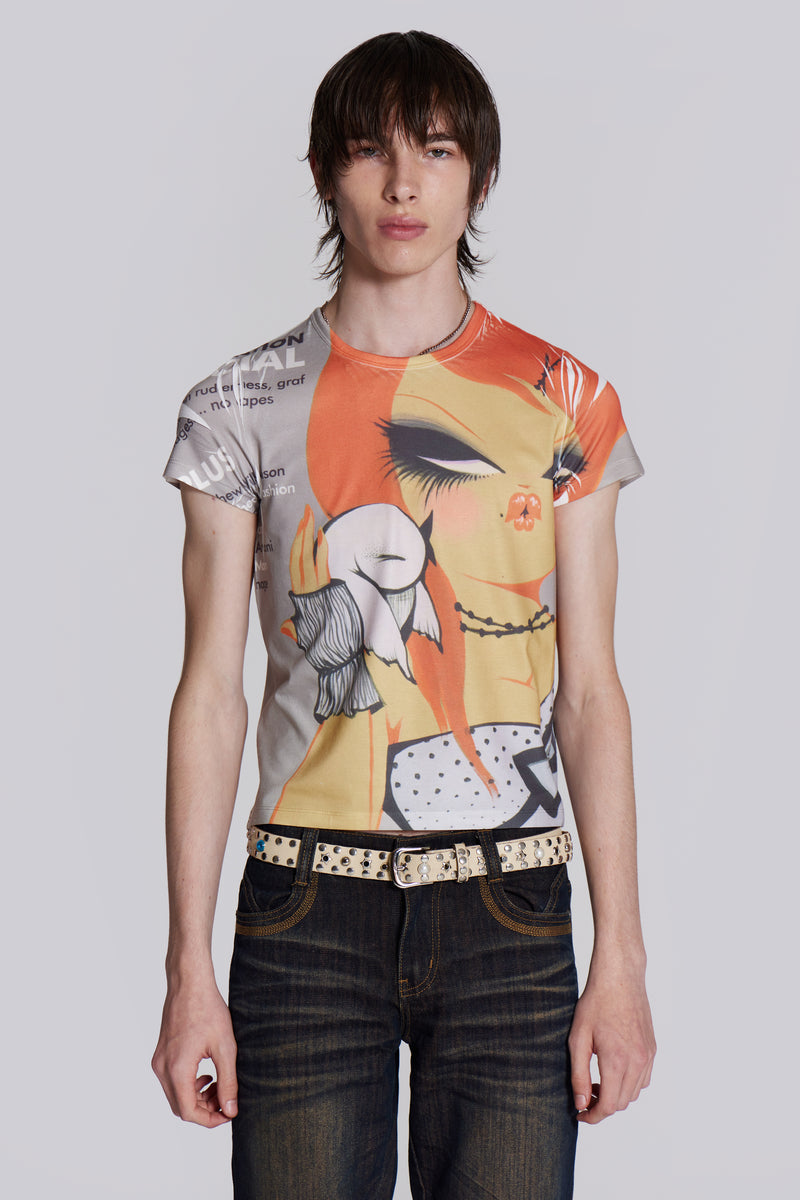 Male wearing graphic print t-shirt styled with denim jeans and studded belt.