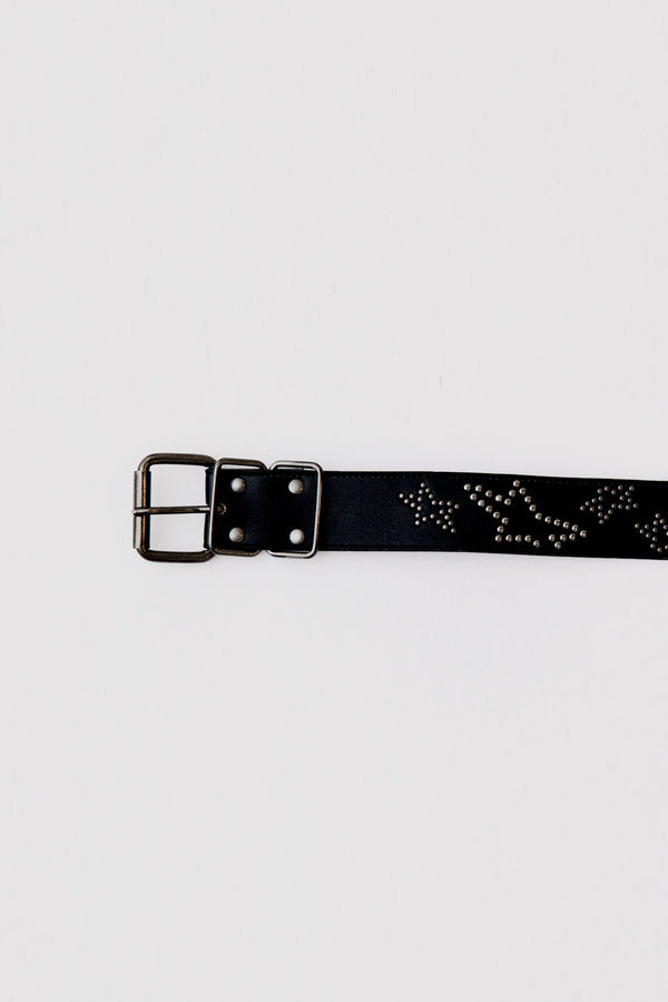 This black leather belt features silver start studded detail. 