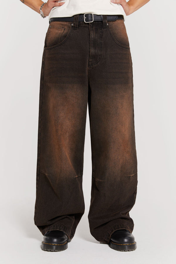 Male wearing vintage brown colossus fit jeans. 
