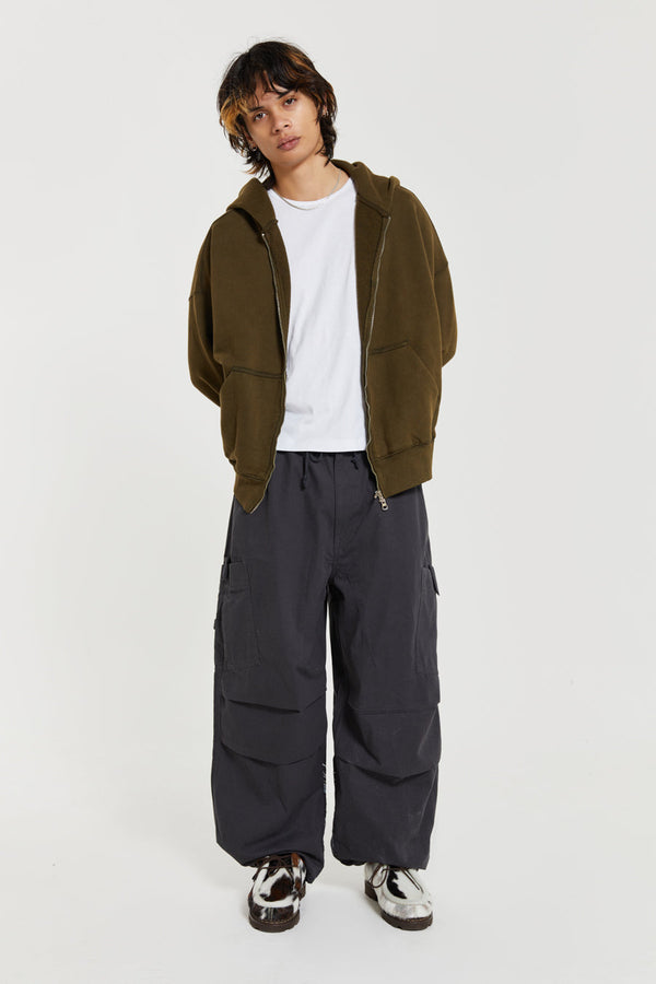 Men's charcoal grey cargo parachute pants featuring 'Scene' embroidery