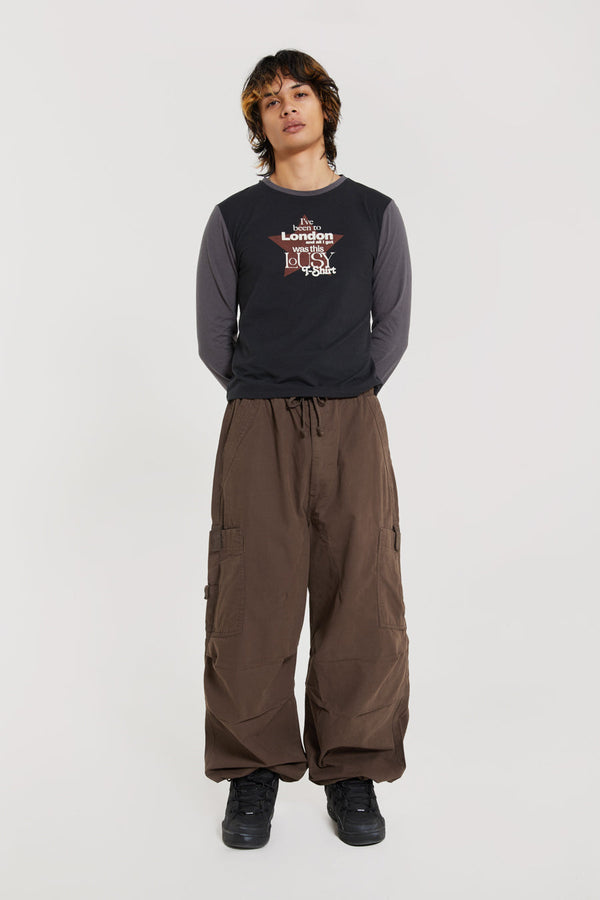 Unisex brown oversized fitted parachute style cargo trousers with six pocket styling. 