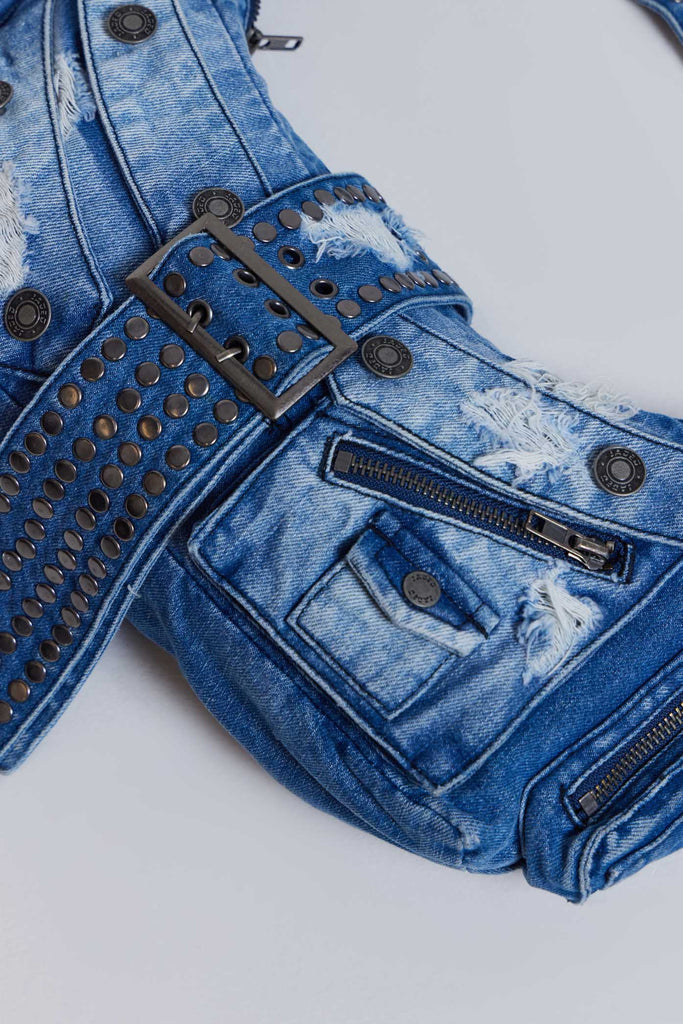 Complete your look with the Amoral Studded Shoulder Bag – crafted from a washed blue denim fabric, this shoulder bag features multi pockets, distressing detail and an XL belt buckle complete with hardware details.