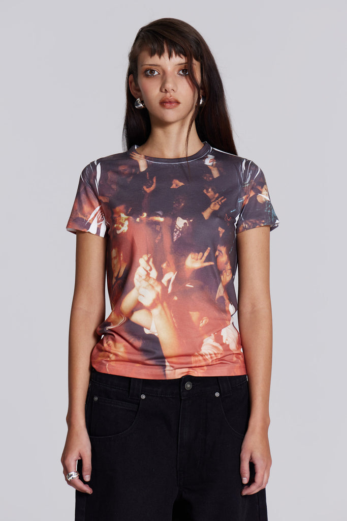 female model wearing shrunken t-shirt with rave crowd graphic allover print,