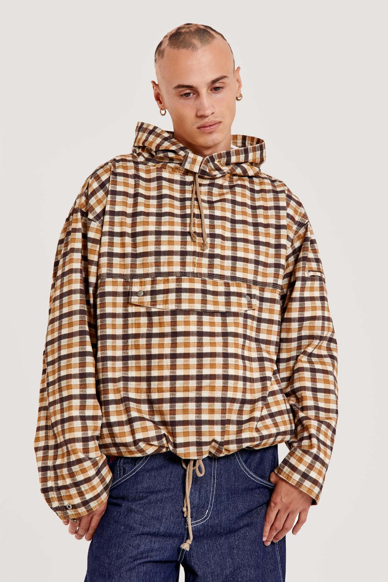Male wearing brown gingham printed check long sleeved pullover jacket. 