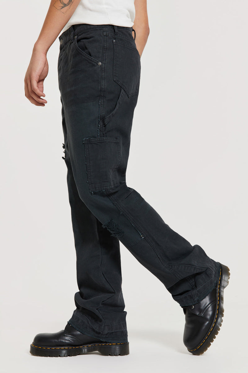 Male wearing Washed Black Carpenter Jeans With Inserted Panel. 