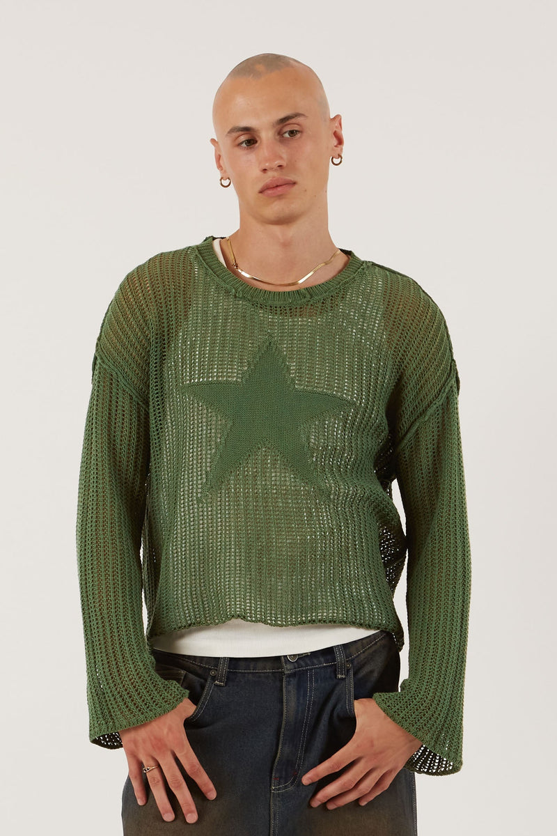 Male wearing Khaki Green Star Loose Knit Jumper. 