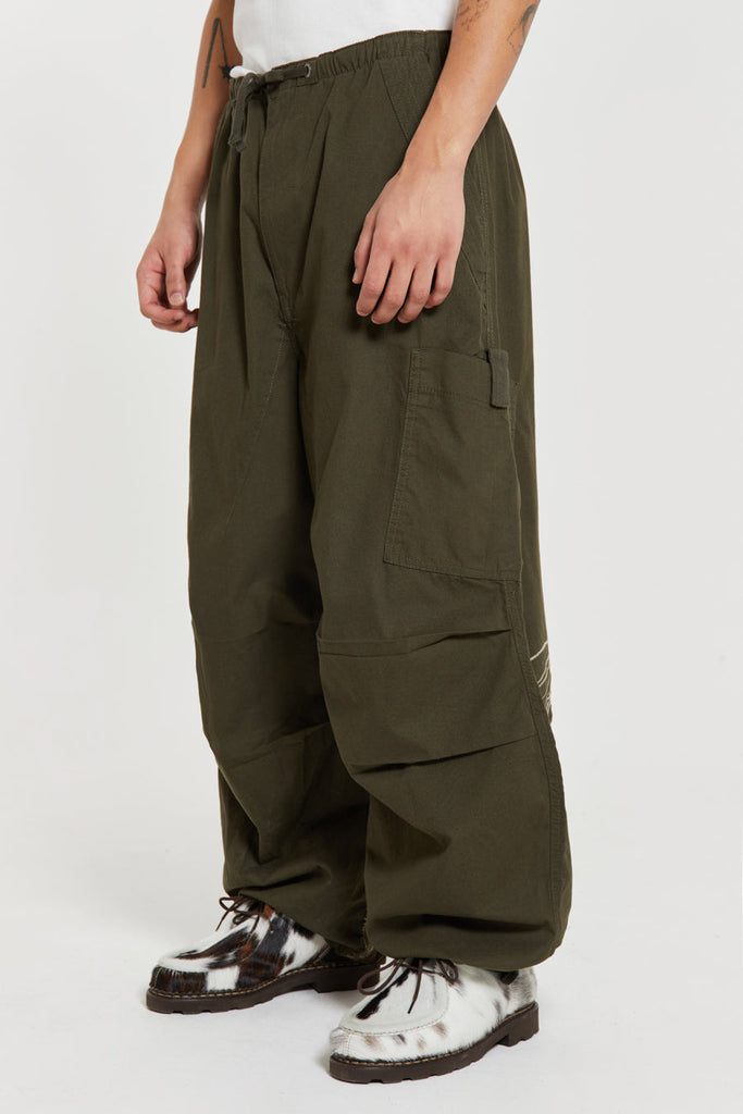 Men's khaki green cargo parachute pants featuring 'Scene' embroidery