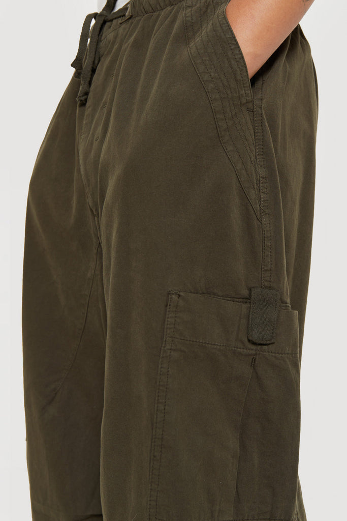 Unisex khaki green oversized fitted parachute style cargo trousers with six pocket styling. 