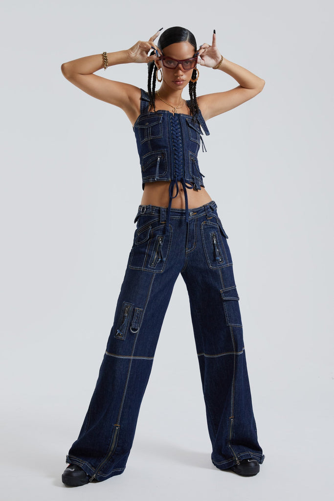 Female wearing blue denim cargo trousers with pocket detail. Styled with the matching denim cargo corset top. 