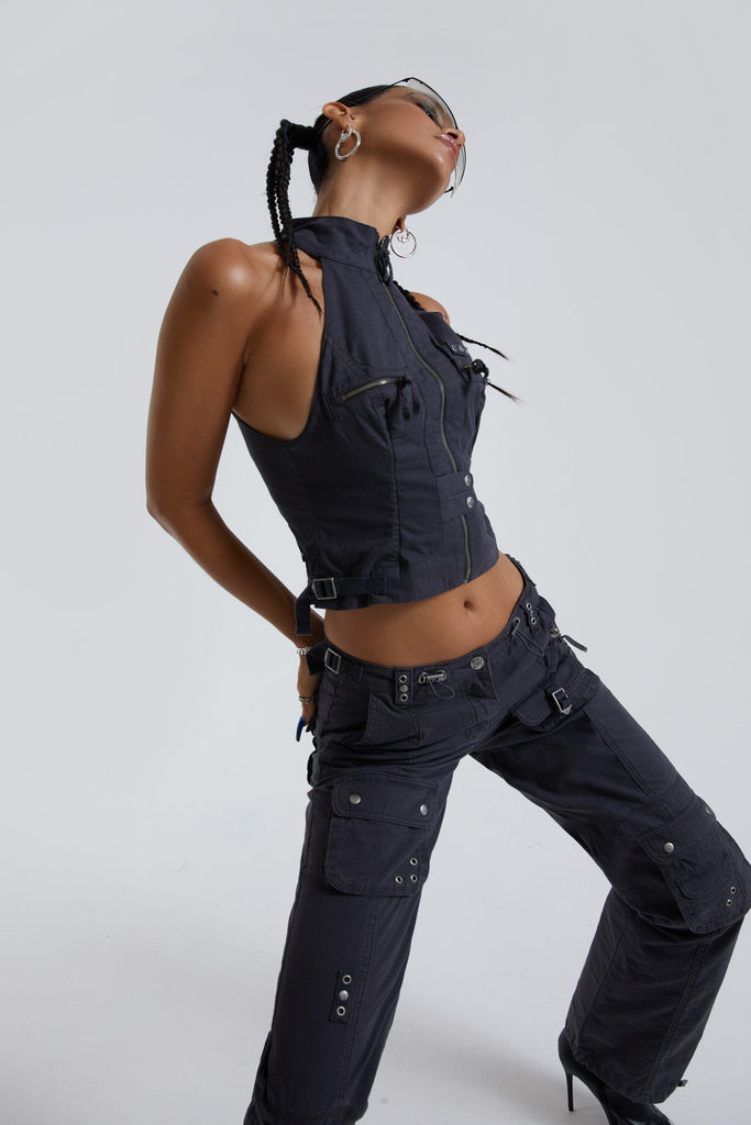 Female wearing vintage grey cargo halterneck style top. Styled with the matching low rise slim fit cargo trousers. 