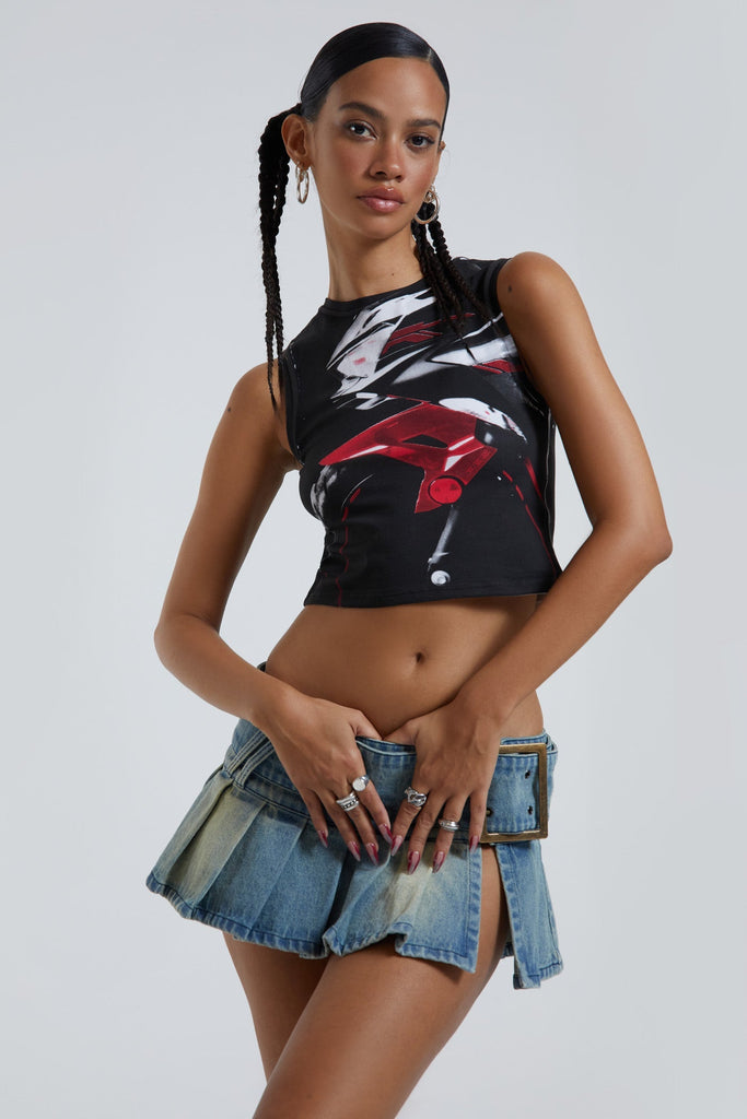 Female wearing motorcycle screen printed black crew neck sleeveless tank top. Styled with the blue denim pleated mini skirt. 