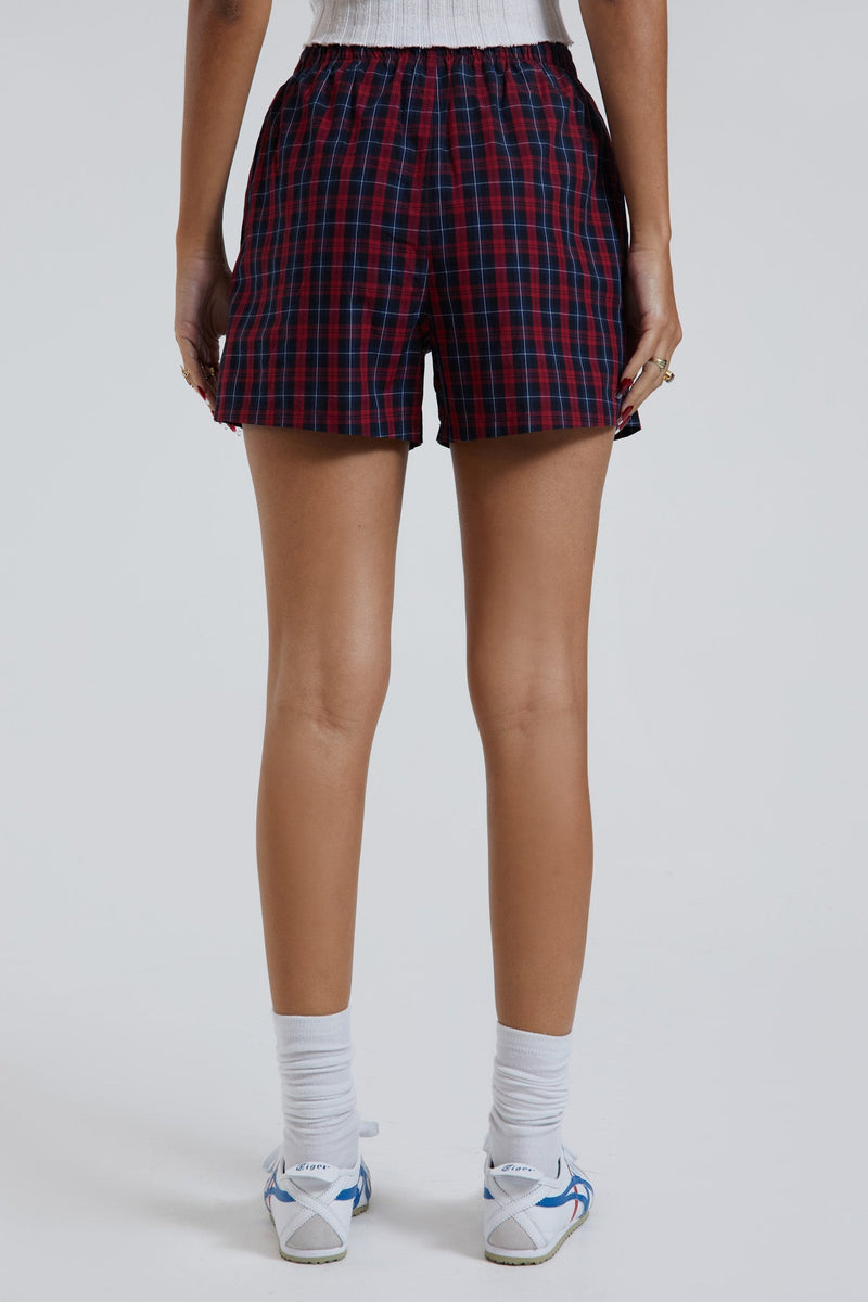 Female wearing blue and green tartan boxer shorts with Union Jack woven label detail.  