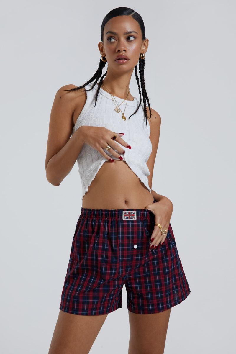 Female wearing blue and green tartan boxer shorts with Union Jack woven label detail.  