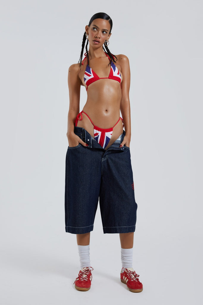 Female wearing Union Jack printed micro triangle and micro bikini top and bottoms. 