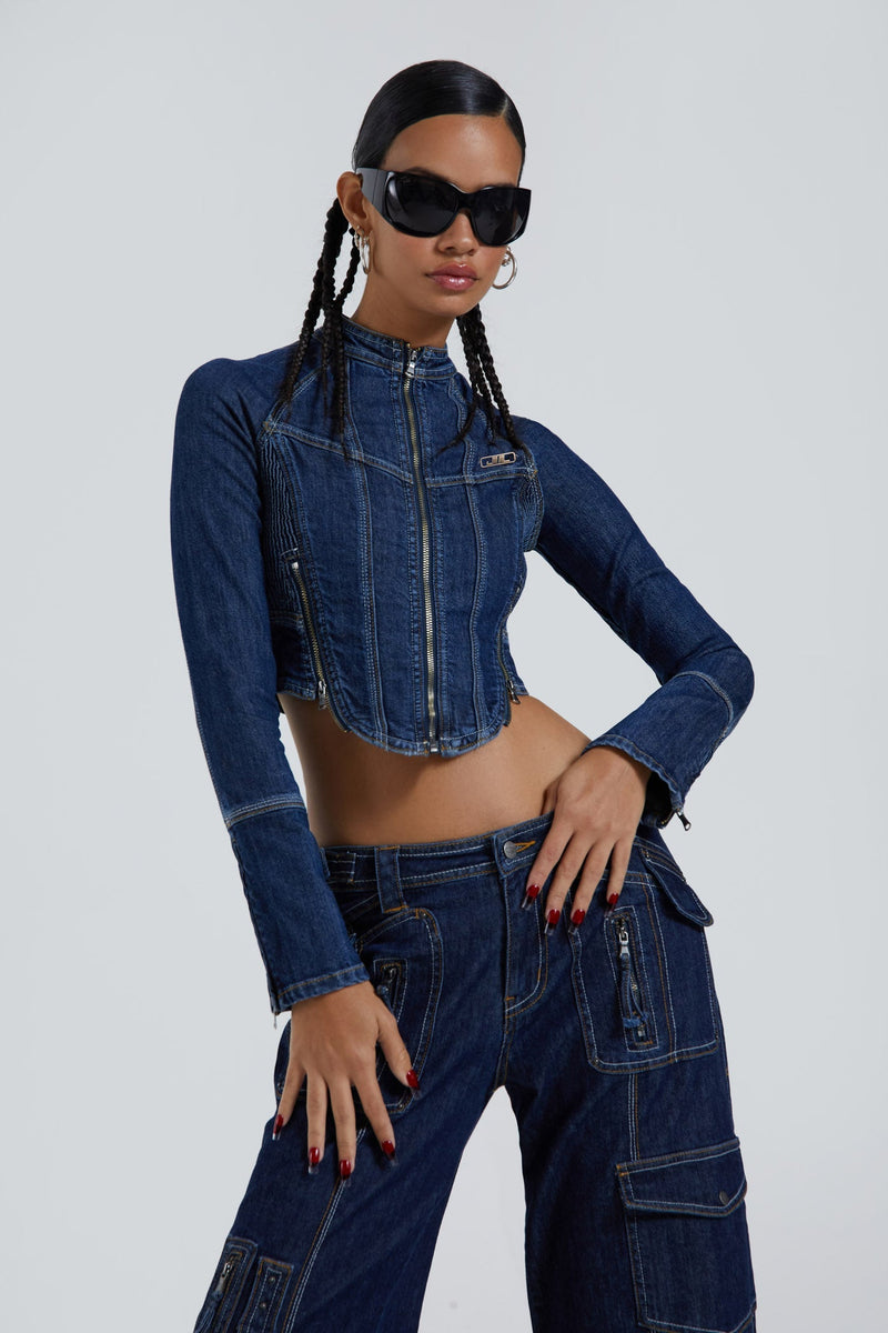 Female wearing blue denim corset motorcycle long sleeve jacket. Styled with the matching denim cargo trousers. 