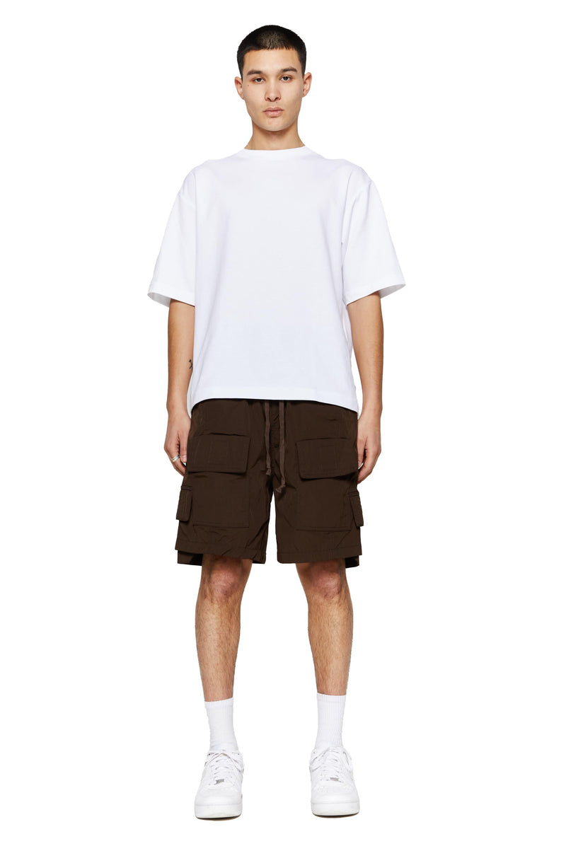 Brown oversized cargo shorts in relaxed fit with ten pocket styling detail. 