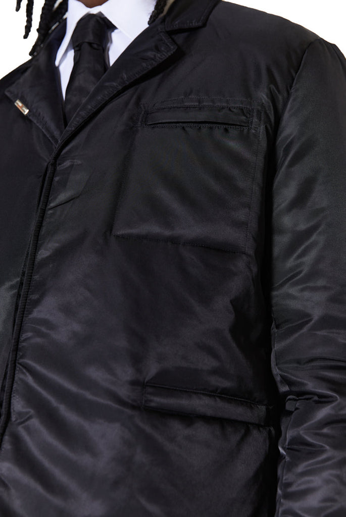 pocket detail of black nylon single breasted blazer