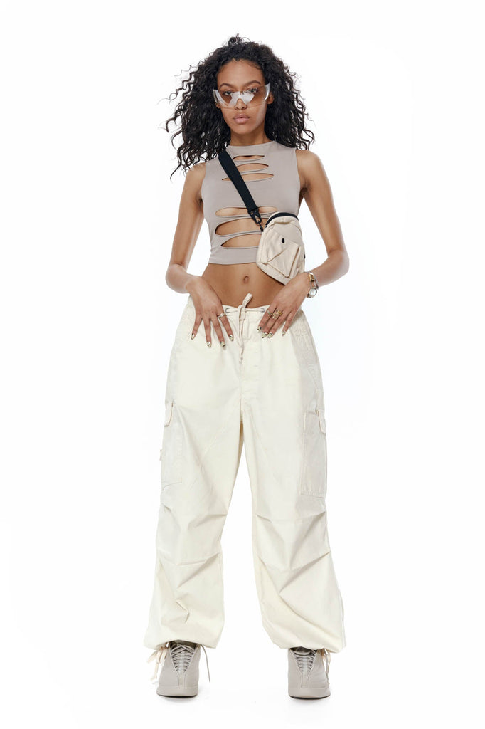 Taupe slash detail scoop neck crop top. Styled with the ecru parachute pants.