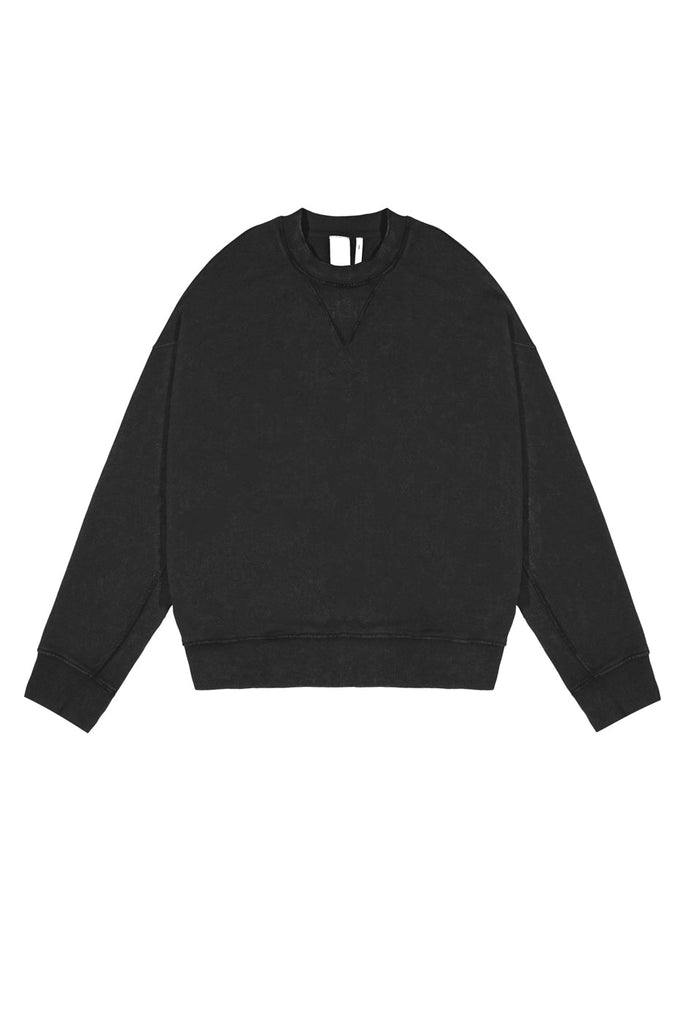 Dust black crew neck oversized sweatshirt with ribbed detailing. Styled with matching joggers. 
