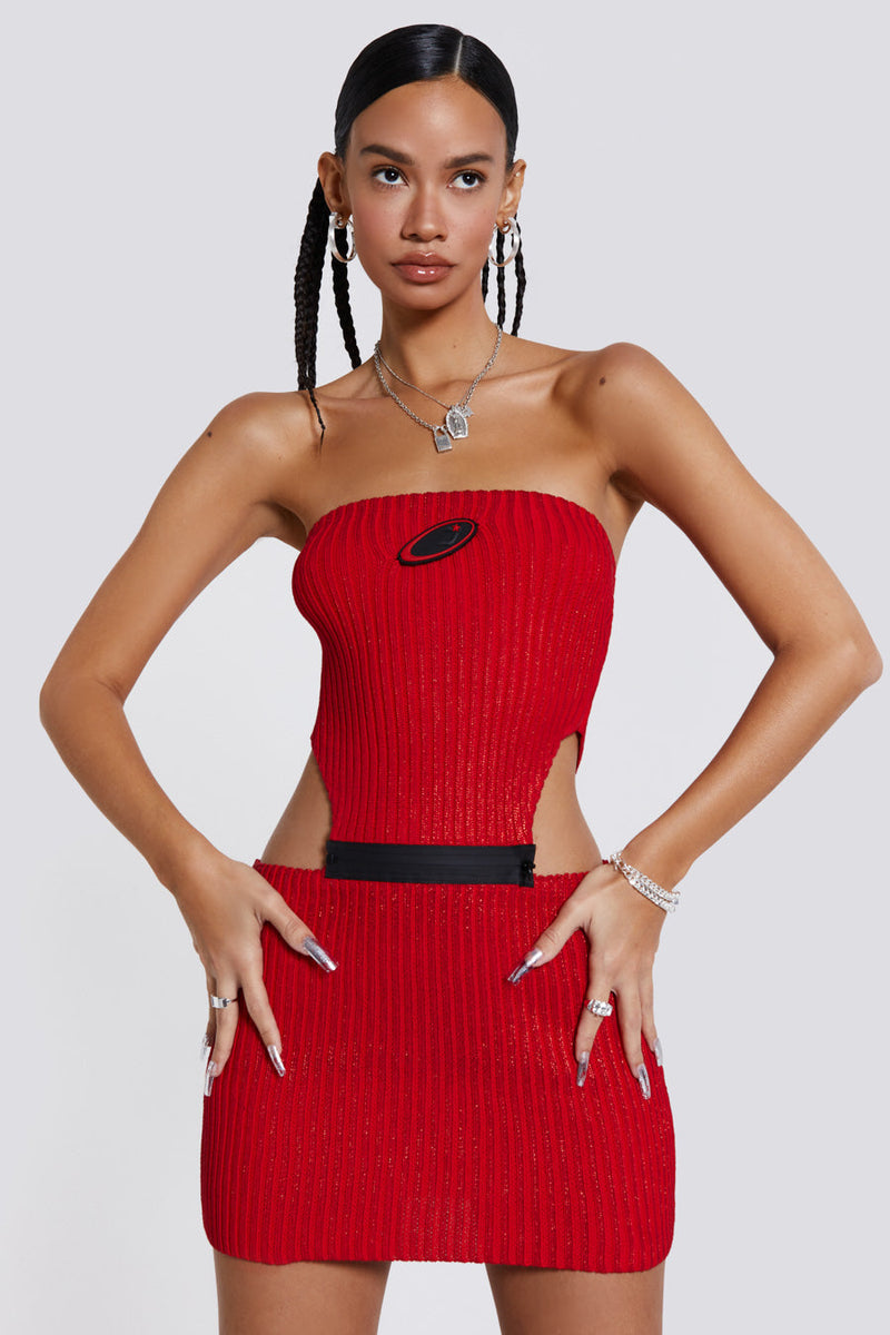 Female wearing red metallic knitted zip off bandeau mini length dress. 
