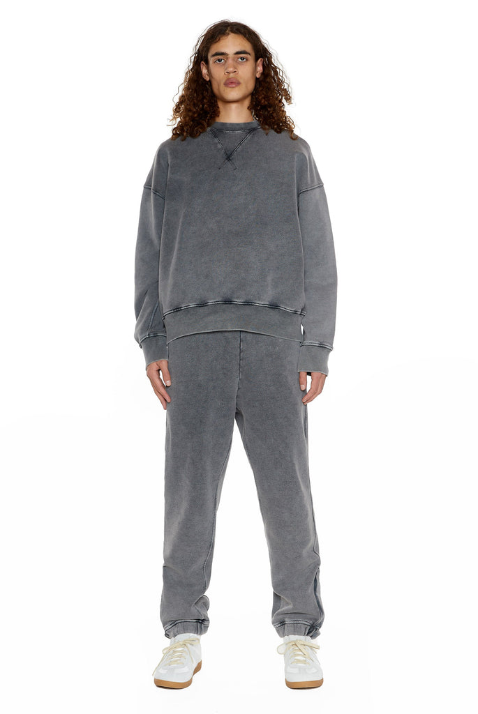Chrome grey cuffed joggers with drawstring waistband detail.  Styled with the matching sweatshirt. 