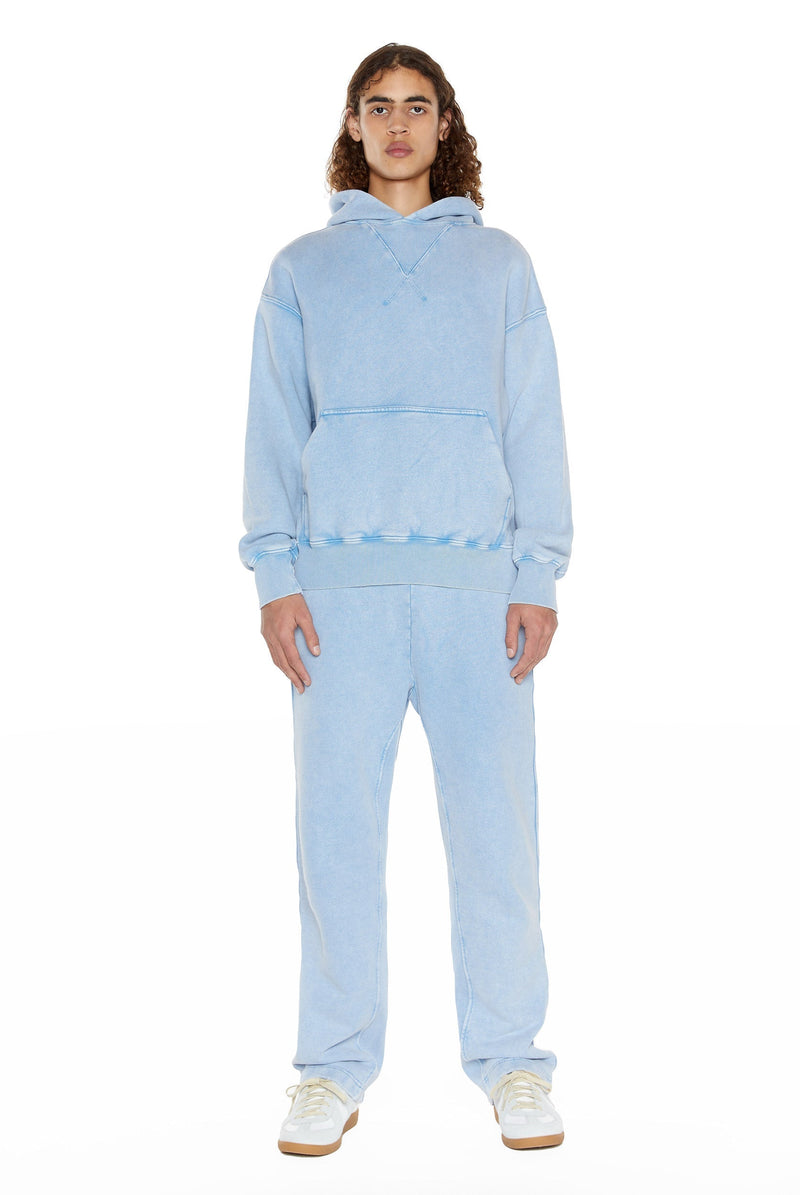 Powder blue oversized hoodie with kangaroo pocket, styled with the matching joggers.  