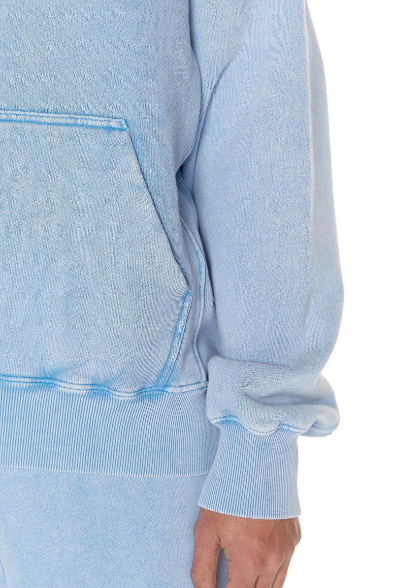 Powder blue oversized hoodie with kangaroo pocket, styled with the matching joggers.  
