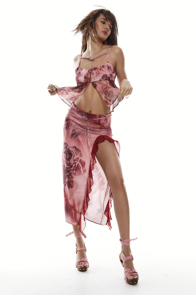 Pink satin cami top with rhinestone belt detail. Styled with the matching midi skirt.